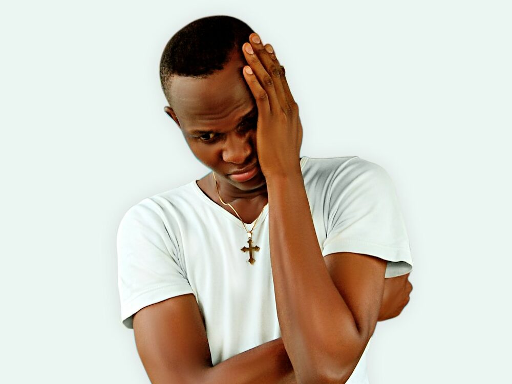 man covering face in mental health struggles